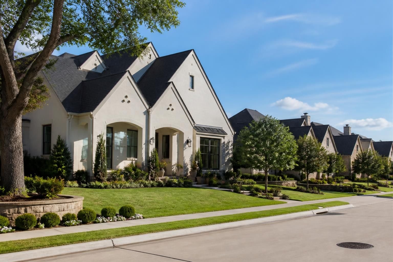 Suburban neighborhood with clean architecture and rooflines.